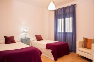Cama o camas de una habitación en Apartamentos Madrid