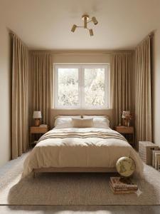 a bedroom with a large bed and a window at Delux Apartament in Haţeg
