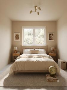 a bedroom with a large bed and a window at Delux Apartament in Haţeg