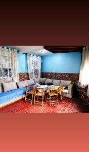 a living room with a couch and a table at Dar Vista Mar in Tétouan