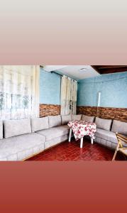 a living room with a couch and a table at Dar Vista Mar in Tétouan