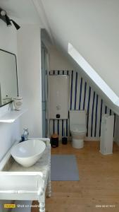 a bathroom with a sink and a toilet at Ty Penty in Riantec +14 photos