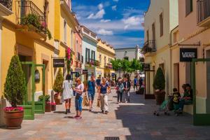 a group of people walking down a street at Stylish Home with Terrace and Private Pool, Maresme in Cabrils