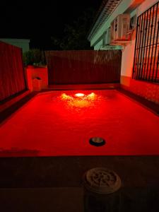a red light on the floor of a backyard at night at Chalet Rural Alkaluz in Las Eras