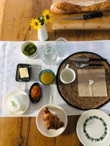 a table with plates of food on a table at la colombe du marais in Courçon +13 photos