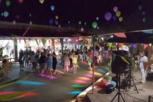 a group of people dancing on a dance floor at a party at Villaggio Turistico Sole e Mare in Nisporto