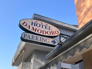 a sign for a hotel marriott moondroit parking at Damodoro Hotel in Pordenone
