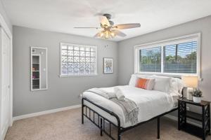 a bedroom with a bed and a ceiling fan at Tucson Oasis by Rather Be Properties in Tucson