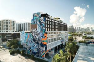 a building with a mural on the side of it at Arlo Wynwood Miami in Miami
