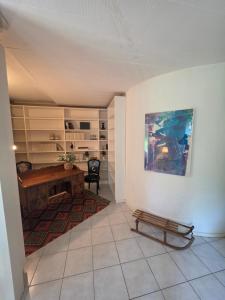 a room with a desk and a chair in it at Appartement 188m2 in Crans-Montana +12 photos