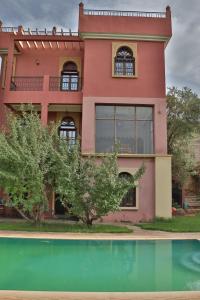 a house with a pool in front of it at Dar TOUFTEN in Agouni
