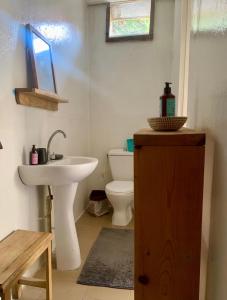 a bathroom with a sink and a toilet at Malika Surf House in Dakar