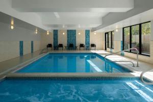 a large pool with blue water in a hotel room at TownePlace Suites by Marriott Anchorage Midtown in Anchorage