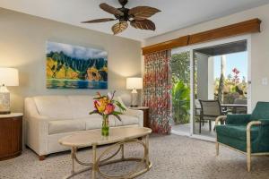 a living room with a couch and a table at Club Wyndham Bali Hai Villas in Princeville