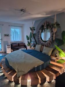 a bedroom with a bed made out of logs at Jungle Dream in Hitzkirch +2 photos
