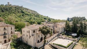 an aerial view of a town with a mountain at B&B Palazzo Agrippa in Bominaco