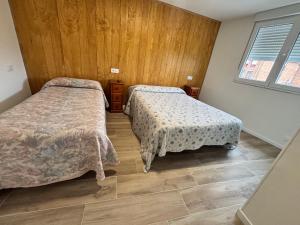 Llit o llits en una habitació de Hotel Viar