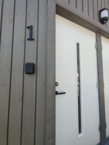 a garage door with the number on it at UrbanHome1 in Rokiškis