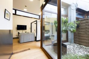 a living room with a sliding glass door and a living room at Loft 2 by Basquelidays in Hondarribia