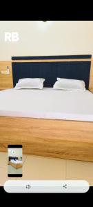 a bed in a room with at Résidences BHELMAR 