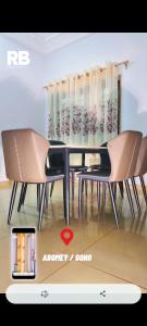 a dining room with a table and two chairs at Résidences BHELMAR 