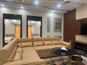 a living room with a couch and a fireplace at Premium 2 bed room apartment in Lahore +21 photos