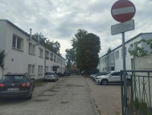 a street with cars parked on the side of the road at Apartament Na Głucho in Nysa