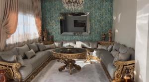a living room with a couch and a table at YourHome in Casablanca