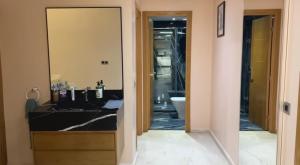 a bathroom with a sink and a toilet and a mirror at YourHome in Casablanca +29 photos