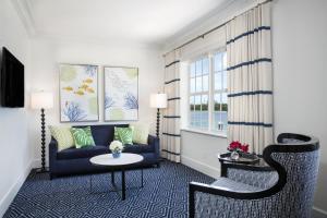 a living room with a couch and a table and chairs at Hilton Key West Resort & Marina in Key West