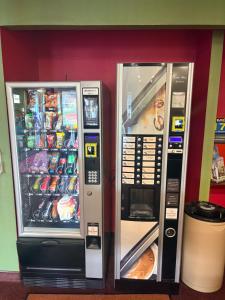 two vending machines are next to each other at Quick Palace Le Mans in Saint-Saturnin