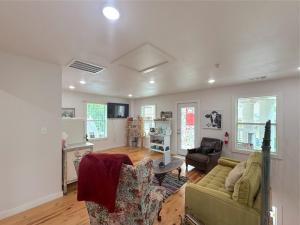 a living room with a couch and a table at -NEW- Spring Wish - Historical Loop Home- in Eureka Springs