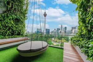a room with a hammock on top of a building at Ceylonz Suites By ANA MALAYSIA in Kuala Lumpur