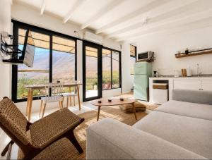 a living room with a couch and a table at Glaciar de Roca Lofts in Horcon