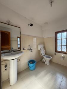 a bathroom with a sink and a toilet at Zotpa Hostel in Leh +22 photos