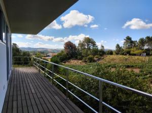 a balcony of a house with a view at Single House in Vila Real
