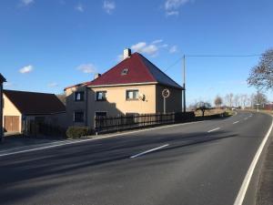 a house with a red roof on the side of a road at Landhaus Oma Gretel - Nossen, Siebenlehn, Freiberg, Meißen, Dresden, Chemnitz  +25 photos
