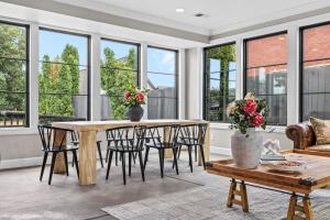 a living room with a table and chairs and windows at The Germantown Inn in Nashville +36 photos