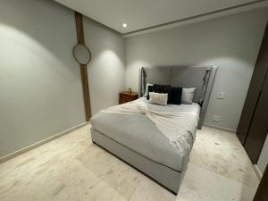 a bedroom with a large bed with pillows on it at Departamento Playa Dorada Punta Mita, Beach Front in Punta Mita +30 photos