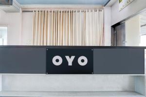 a sign with the ovo logo on a desk at Hotel O Star Inn in Hyderabad