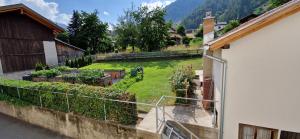 a view of a garden from a house at Ferienwohnung Tulipana in Müstair