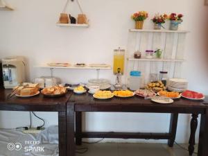 a table with many plates of food on it at Camellia Vang Vieng in Vang Vieng +7 photos