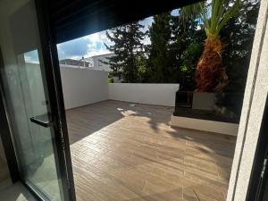 a view of a patio through a sliding glass door at Villa zhara in Bizerte