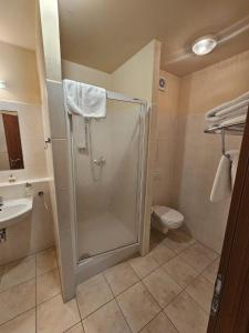 a bathroom with a shower and a toilet at Pokojíček 512 in Lázně Luhačovice