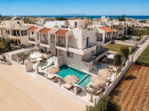an aerial view of a house with a swimming pool at AVENA Suites in Kato Gouves