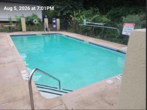 a large swimming pool with blue water in a building at Comfort Inn Acworth - Kennesaw Northwest in Acworth