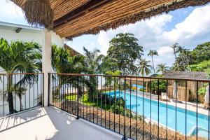 a view from the balcony of a villa with a swimming pool at Beachfront Dream in Ban Tai in Ban Tai