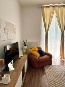 a living room with a couch and a window at Casa Dolce Casa in Guardiagrele