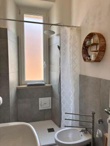 a bathroom with a tub and a toilet and a sink at Casa Dolce Casa in Guardiagrele +18 photos