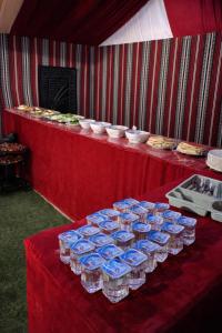 a table with a bunch of water bottles on it at Wadi rum bubble camp in Wadi Musa